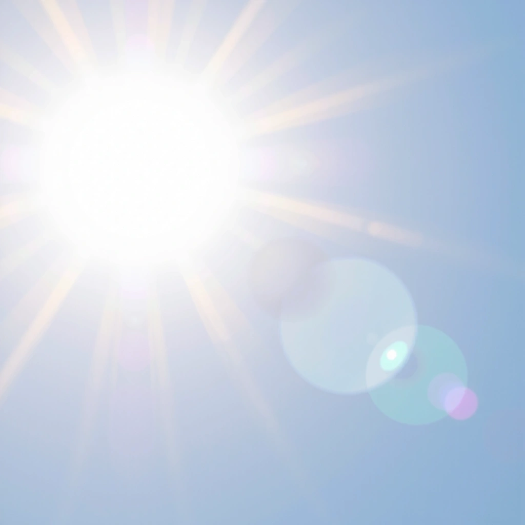 Słońce świecące jasno na błękitnym niebie